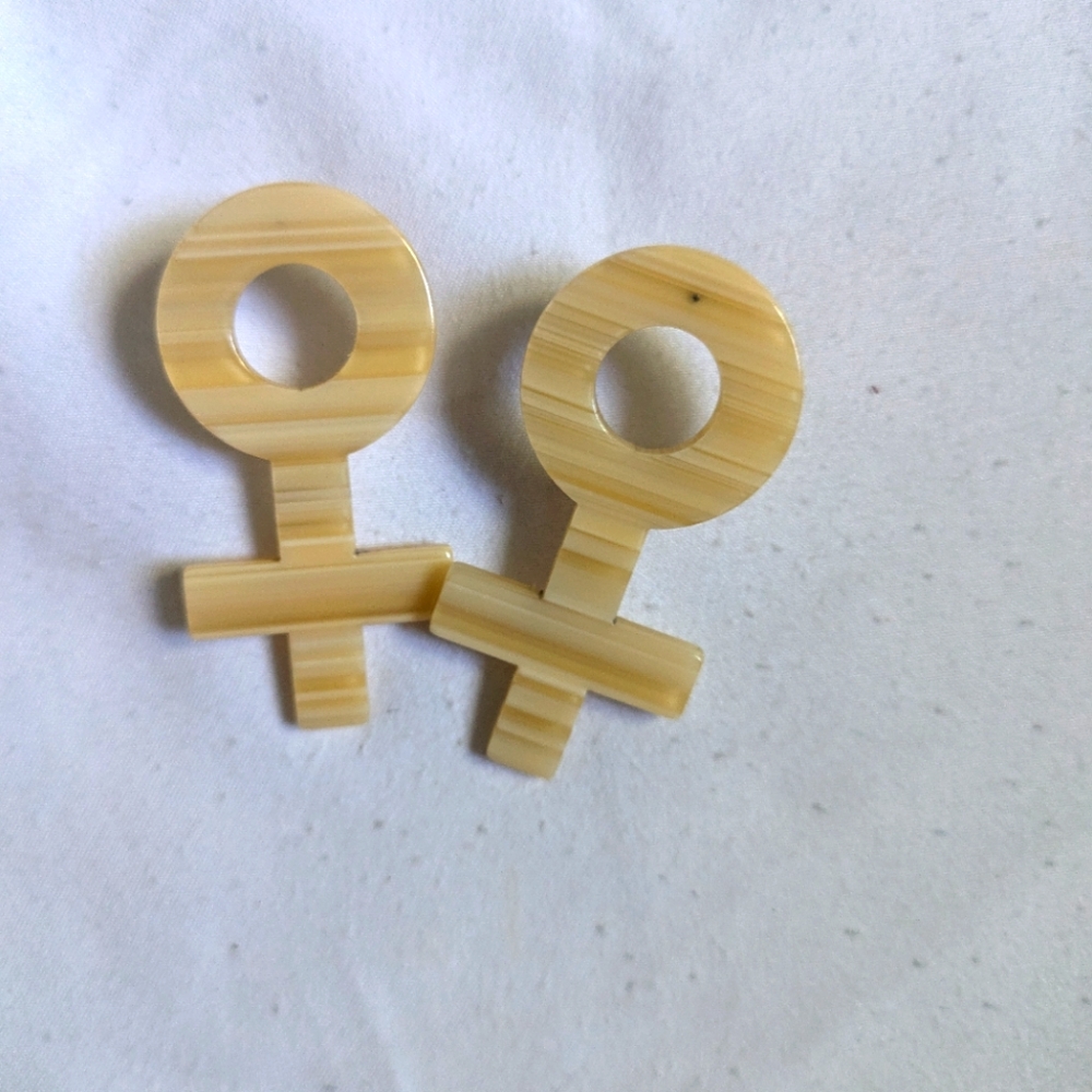 Female sign earrings
